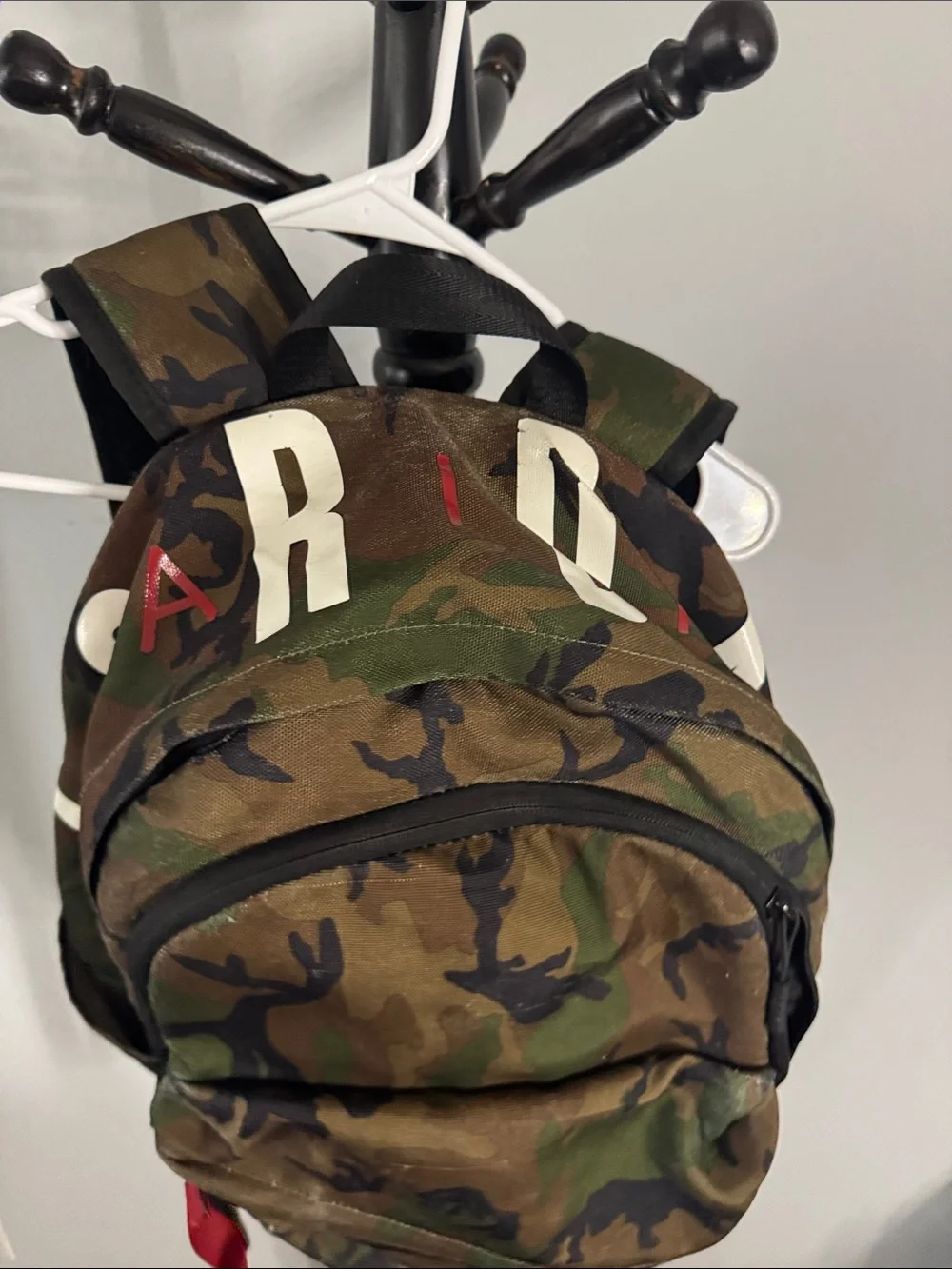 Camouflage Men's Backpack with Red Accent Pulls
